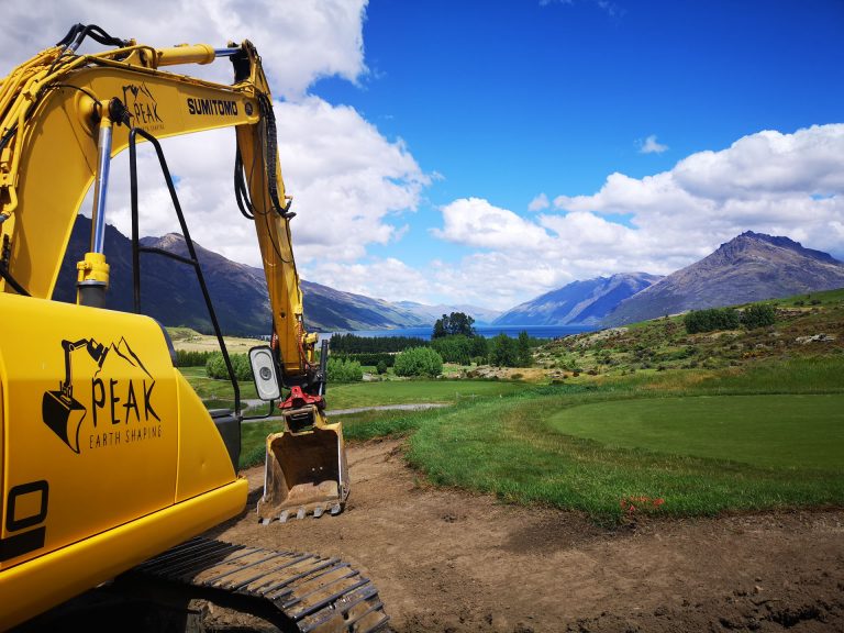Peak Earth Shaping Excavator beginning the site excavation on rural property with lake views in queenstown